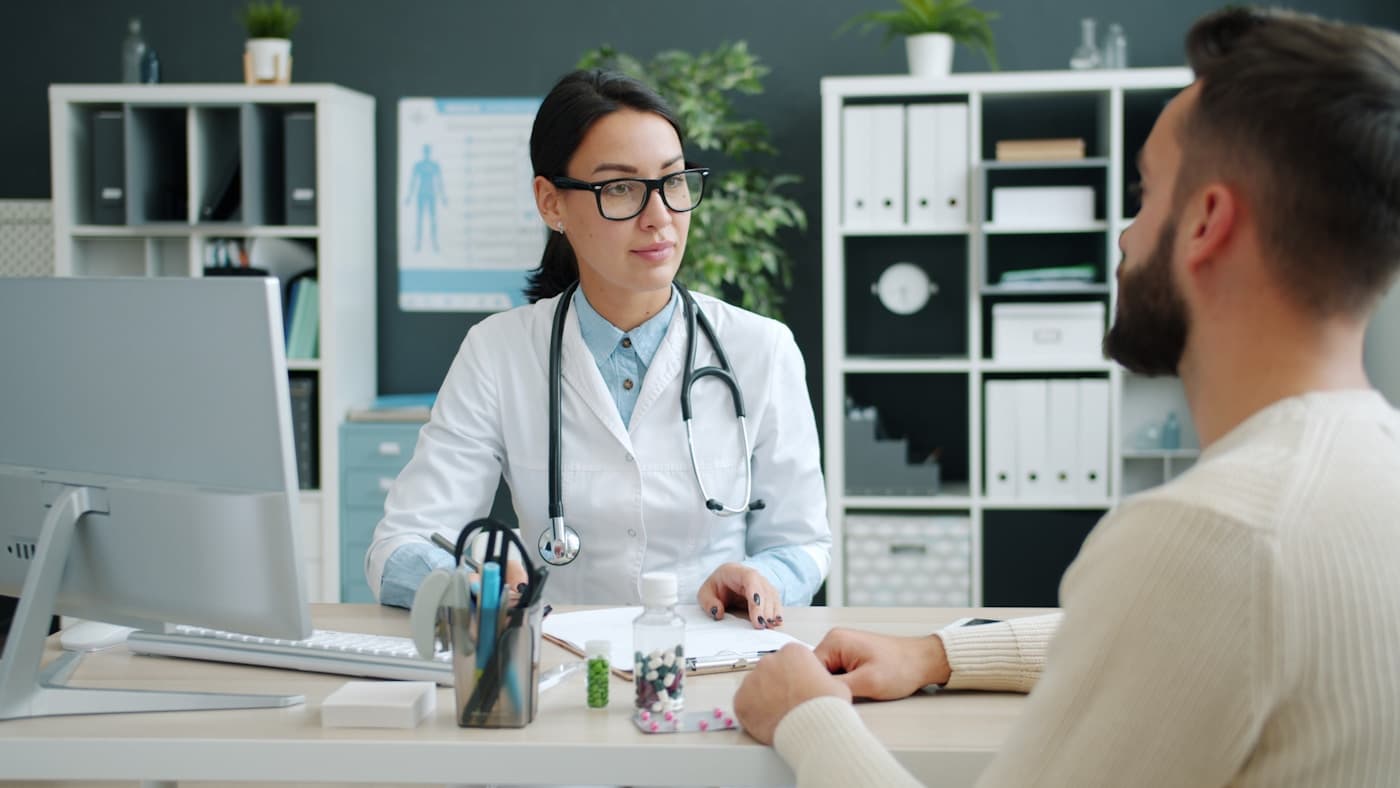 Patient discussing hearing loss with an audiologist