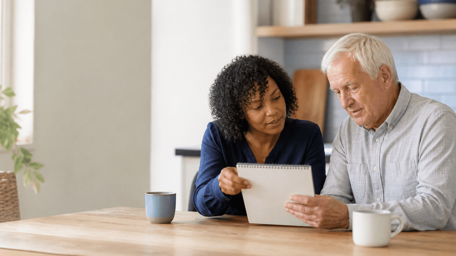 Adult child and parent preparing for a hearing evaluation