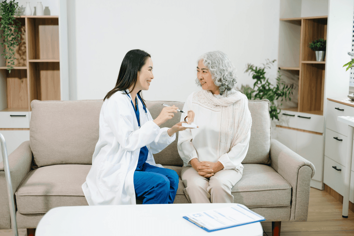 Audiologist welcoming a patient for a first hearing appointment